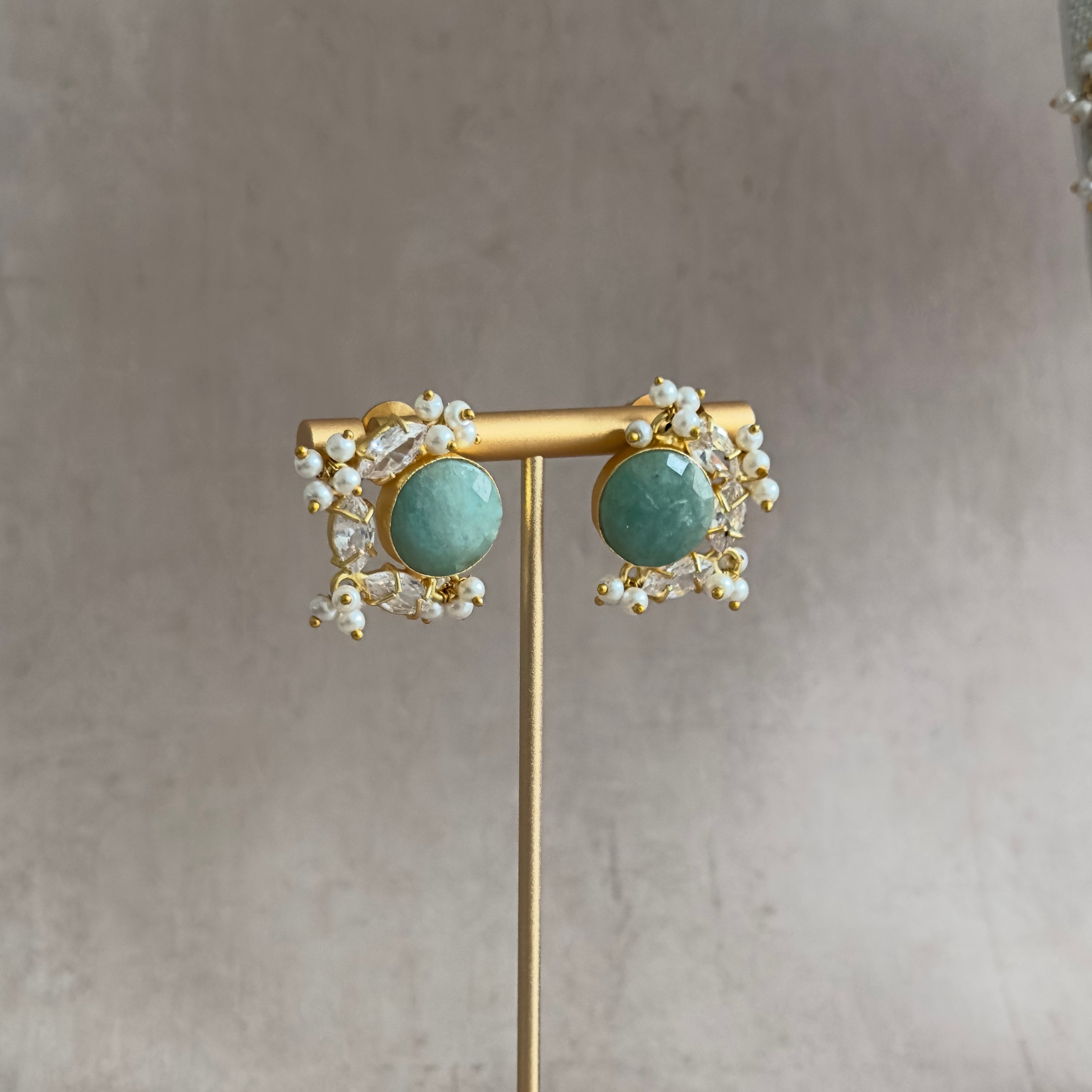 Elevate your look with our Suki Jade Choker Set, featuring stunning natural amazonite gemstones and luscious cubic zirconia for that extra sparkle. Complete your outfit with the matching tikka and earrings. Perfect for any occasion.