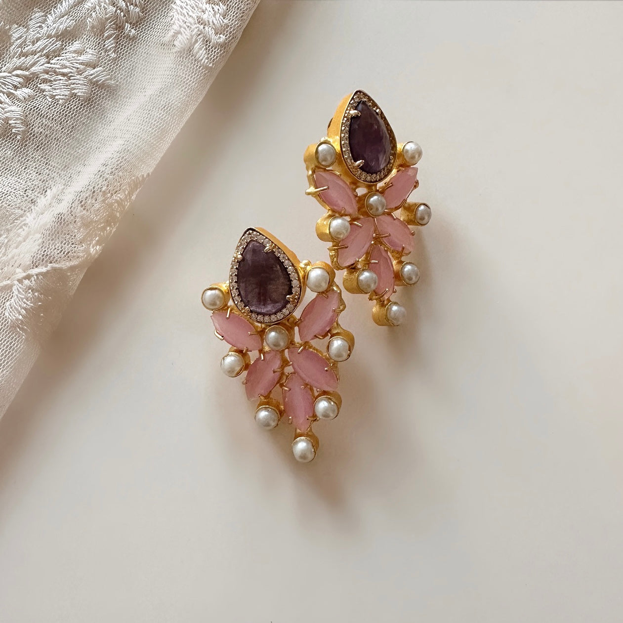 Indulge in the vibrant beauty of our Malibu Purple Pink Earrings. With stunning hues of purple and pink, these earrings are sure to add a pop of color to any outfit. Elevate your style and make a bold statement with these eye-catching earrings. Upgrade your jewelry collection today!