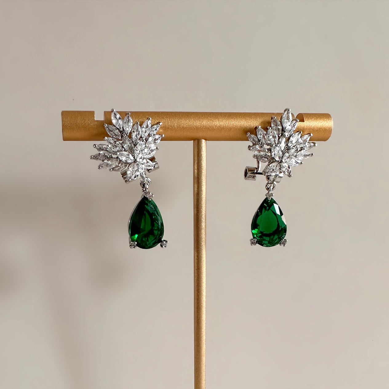 Sparkle and shine in these elegant Demi Drop Crystal Earrings! Crafted from high-quality cz crystals, these earrings are sure to add a touch of timeless beauty and sophistication to your wardrobe, available in three stunning colours. Earring drop 3cm