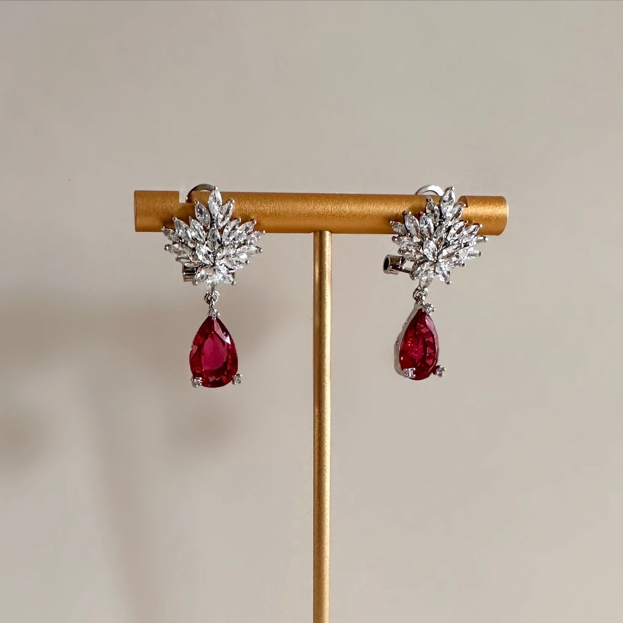 Sparkle and shine in these elegant Demi Drop Crystal Earrings! Crafted from high-quality cz crystals, these earrings are sure to add a touch of timeless beauty and sophistication to your wardrobe, available in three stunning colours. Earring drop 3cm
