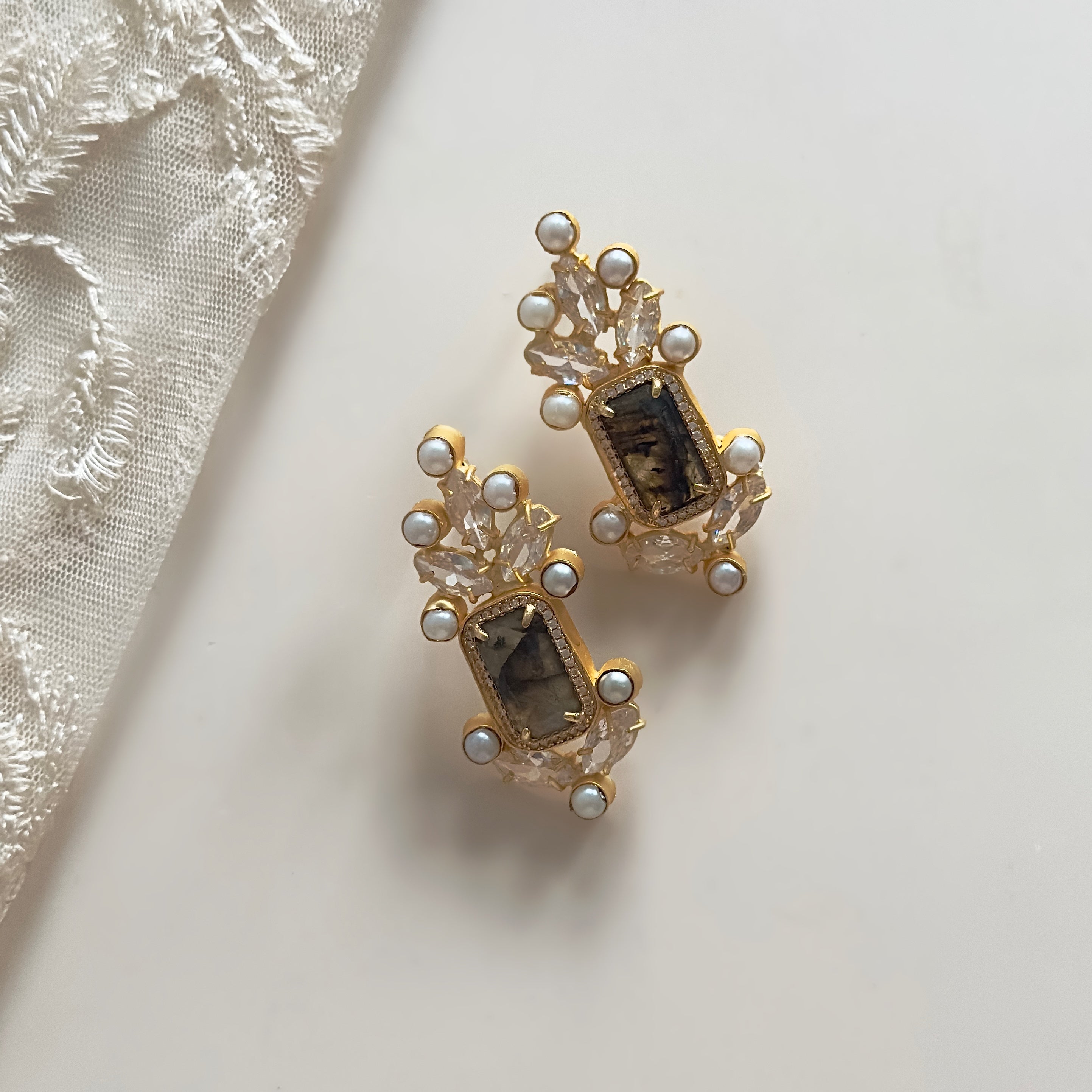 Elevate your style with our Eva Smokey Crystal Earrings. Featuring an elegant design, these earrings are the perfect accessory to add a touch of sophistication to any outfit. Feel confident and effortlessly stylish with these stunning earrings.