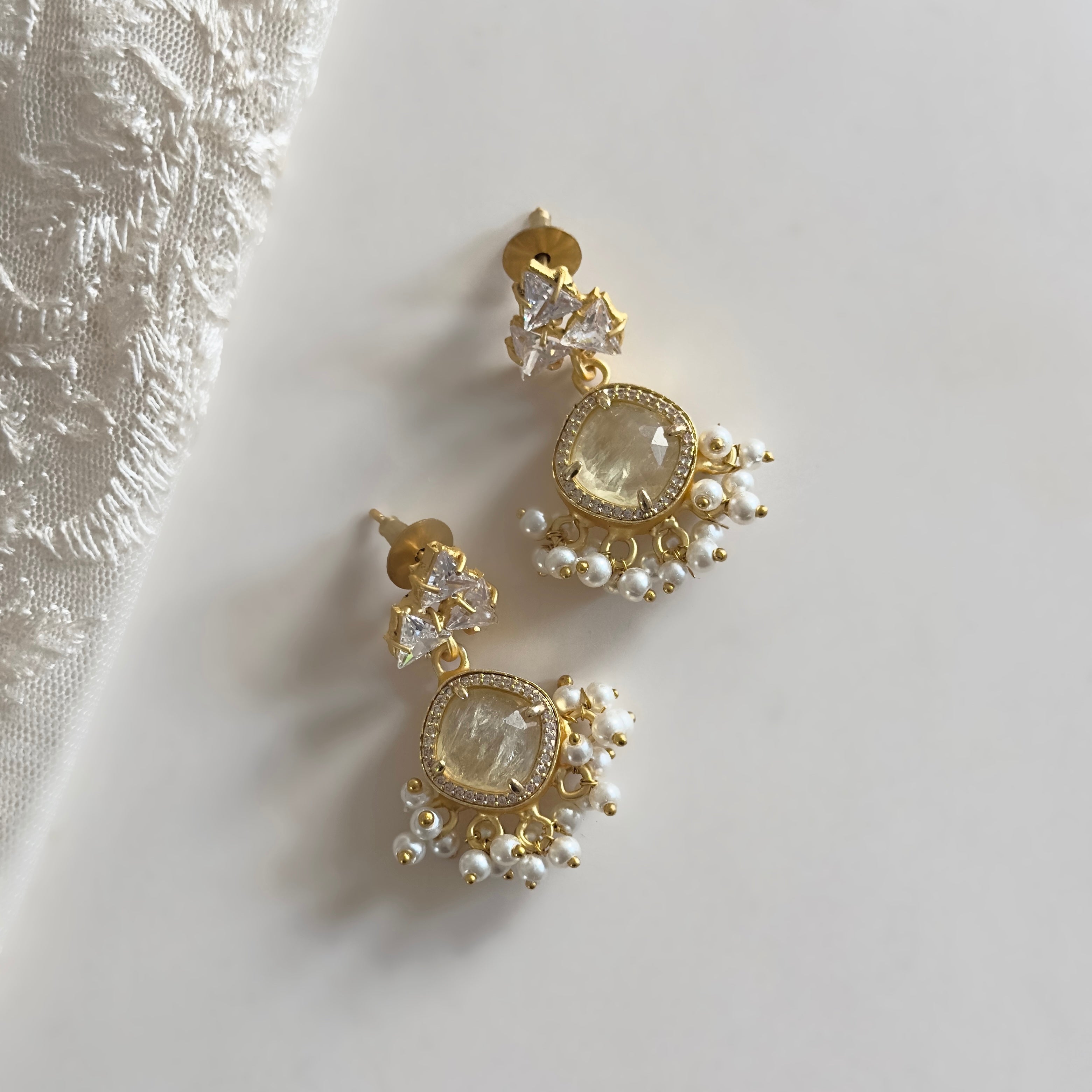 Upgrade your jewelry collection with our stunning Honey Crystal Drop Earrings! These earrings feature gorgeous honey quartz and sparkling cubic zirconia that effortlessly add a touch of elegance to any outfit. Elevate your style and turn heads with these beautiful earrings.