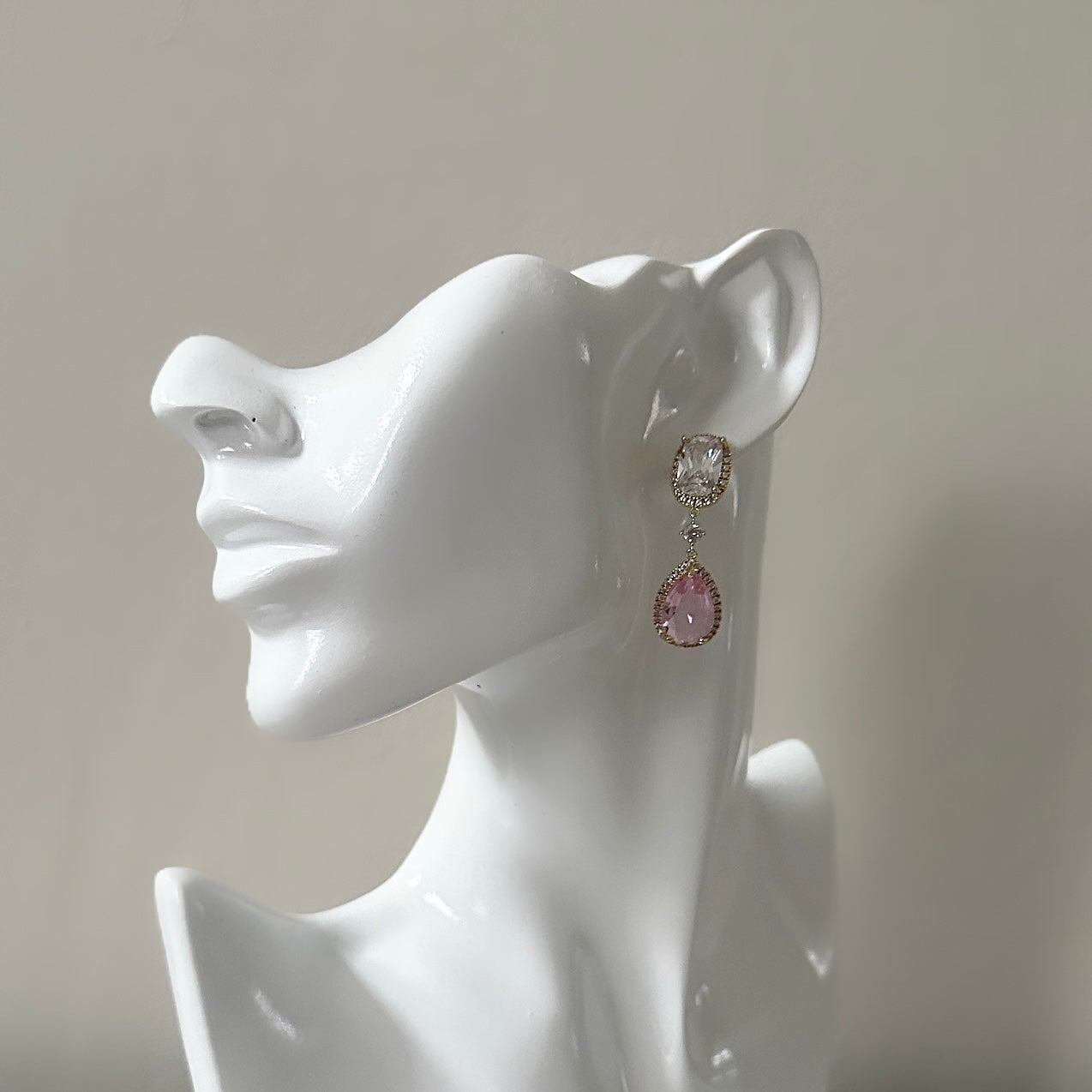 These sparkling Pink Crystal  Earrings, crafted with cz crystals, will add a touch of elegance and sparkle to any ensemble. The exquisite drop earring design and dazzling cubic zirconia crystals will make you shine. Elevate your style and make a stunning statement with these beautiful earrings. Available in a silver & gold finish. Earring drop 4.2cm