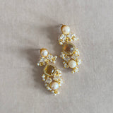 Behold the beauty of these exquisite Sana Honey Quartz Earrings. Crafted from shimmering honey quartz and adorned with pearl accents and sparkling cz crystals, these earrings are perfect for any special occasion. Add an air of refinement and sophistication to your style with these luxurious earrings.