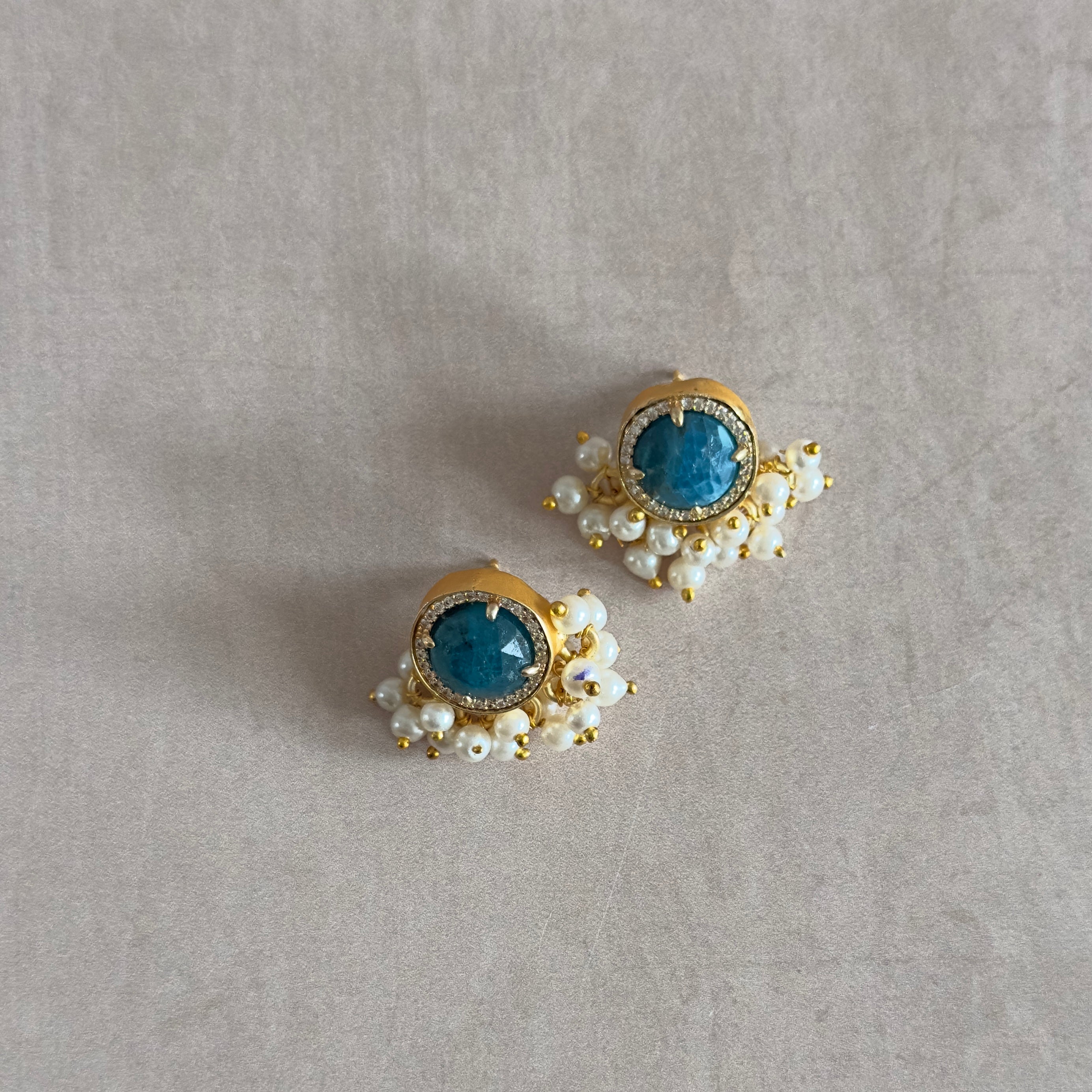 Elevate your style with our Indi Teal Stud Earrings. These earrings feature a classic stud design that adds timeless elegance to any outfit. Make a statement with confidence and sophistication.