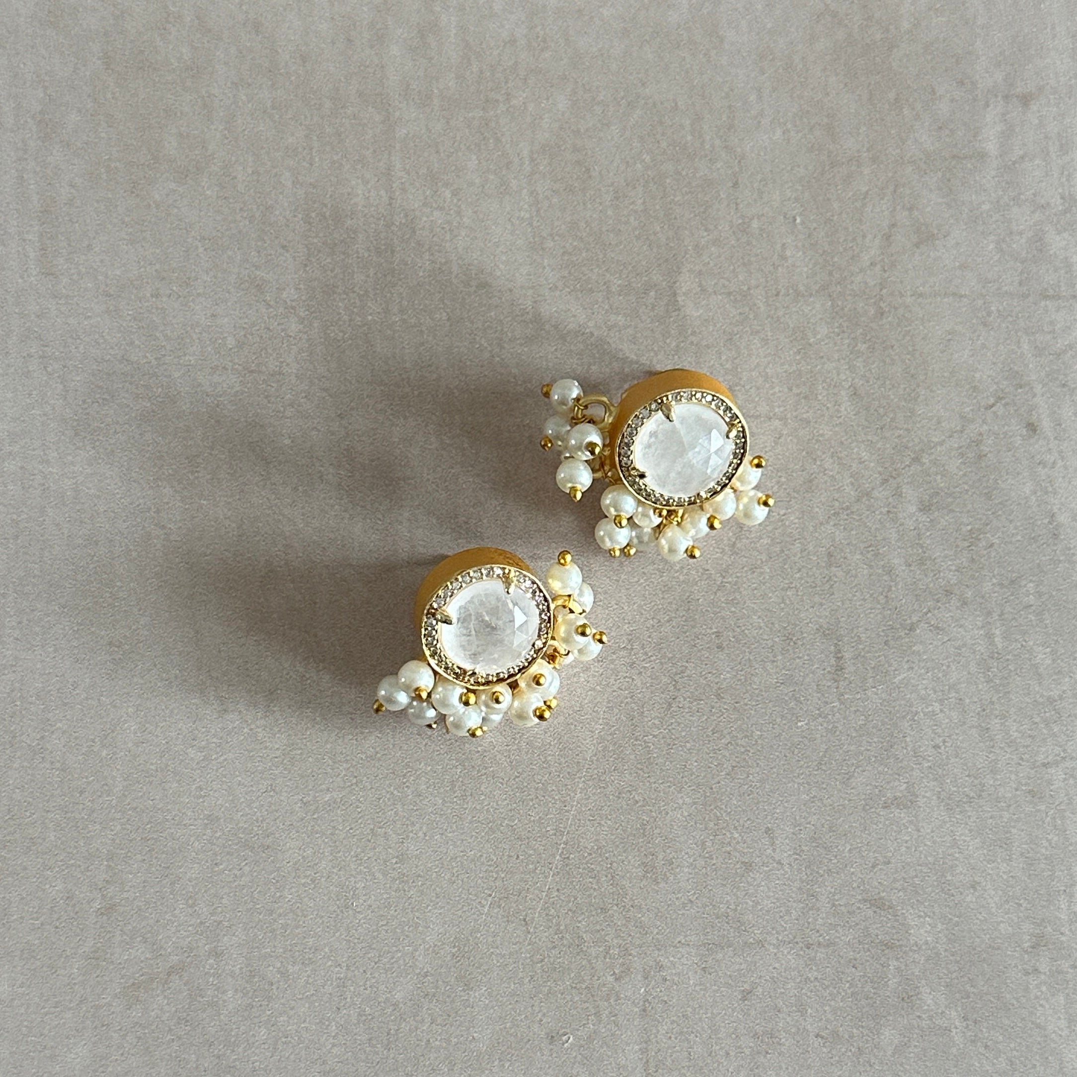 Add a touch of elegance to any outfit with our Indi White Stud Earrings. Crafted from white quartz crystal, these classic studs exude timeless beauty and charm. Make a statement without saying a word.