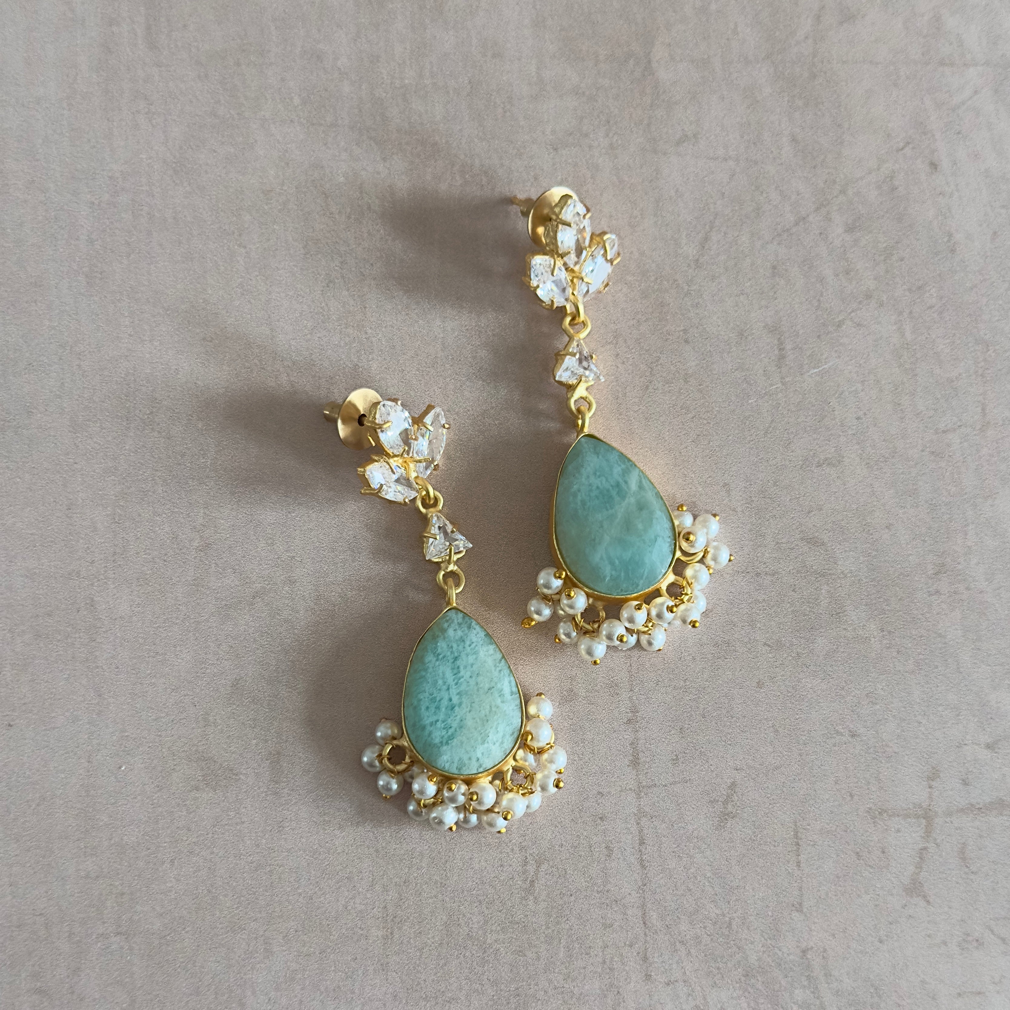 Crafted with stunning amazonite stones and sparkling cubic zirconia, the Sarah Jade Drop Crystal Earrings are a must-have accessory for any fashion-forward individual. These earrings effortlessly add a touch of elegance to any outfit, making them the perfect addition to your jewelry collection.