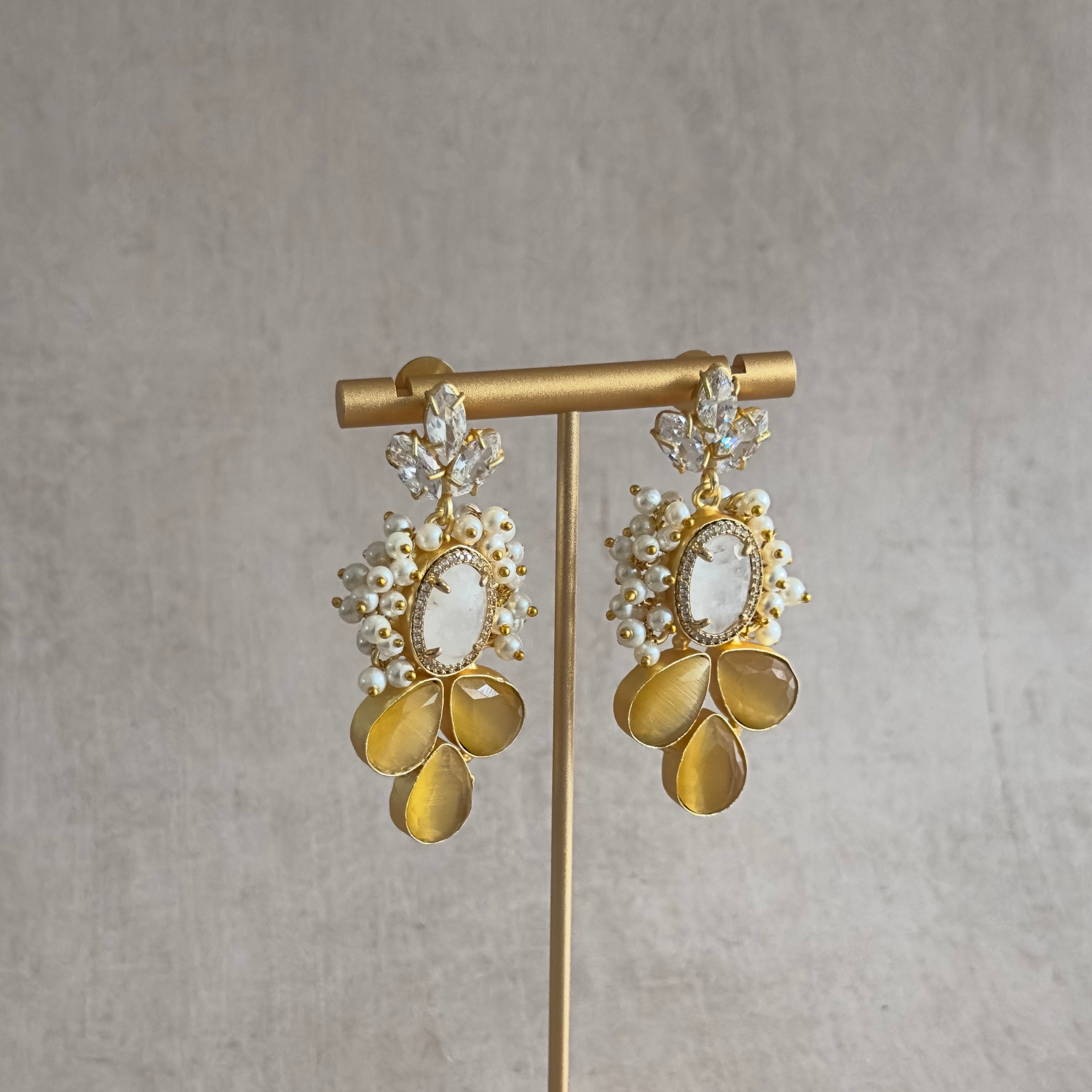 Elevate your summer style with our Silvie Crystal Drop Earrings! The vibrant hues of white and lemon add a touch of playfulness to any outfit. Perfect for those who want to make a statement. Bring out your inner fashionista with these stunning earrings. Order today and be summer ready!