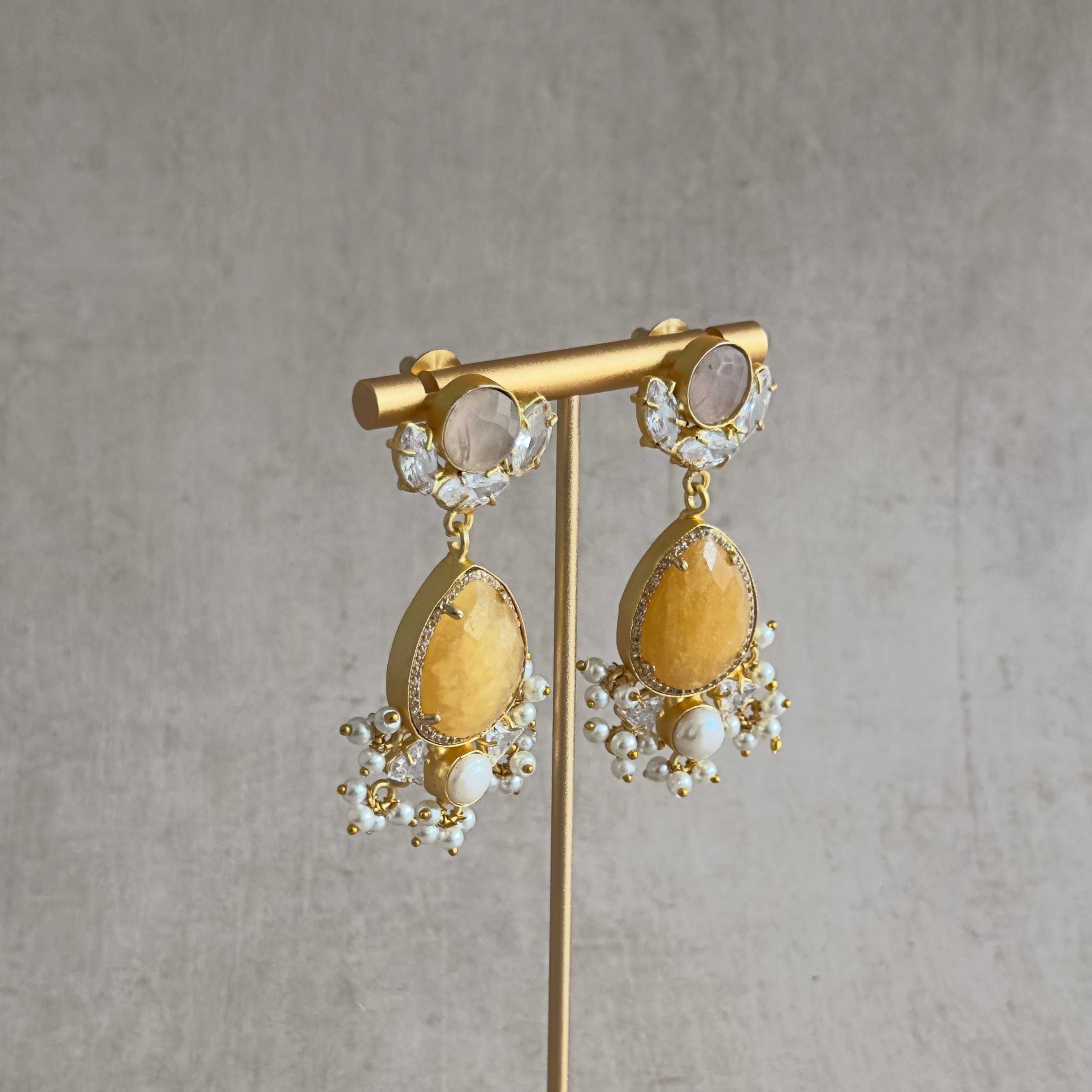 Embrace the summer vibes with our Tamara Melon Drop Earrings! Each earring features a colorful array of gemstones that will add a pop of color to any outfit. The pearl accents provide an elegant touch, making these earrings perfect for any occasion. Get ready to turn heads and elevate your style with these stunning statement earrings!