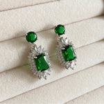 These Liberty Earrings feature emerald gemstones framed by sparkling crystal zirconia in an elegant setting. Crafted with exquisite detail, they are the perfect accessory for any occasion. Earring drop 2.5cm