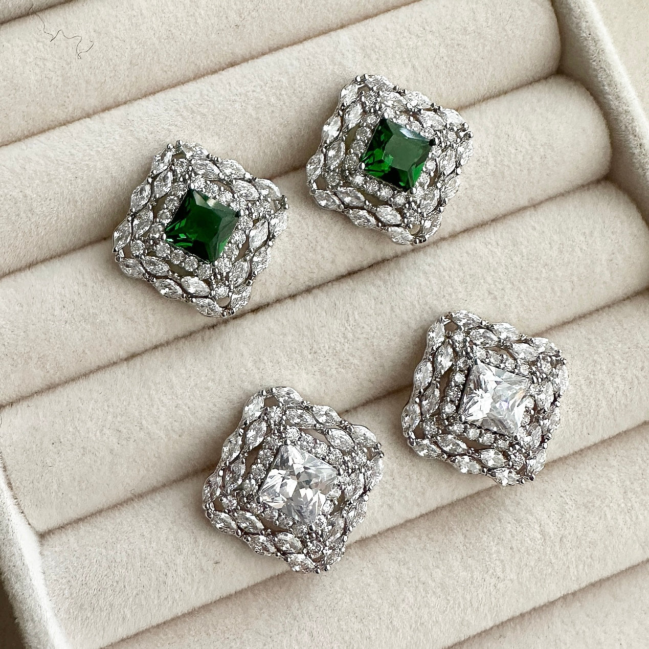 Add a touch of luxury to any ensemble with the Maiya Crystal Earrings. Embellished with dazzling cz crystals crafted in two shades, green and crystal, these earrings will bring a hint of glamour to any outfit. A beautiful adornment for any special occasion. Earring drop 2x2cm