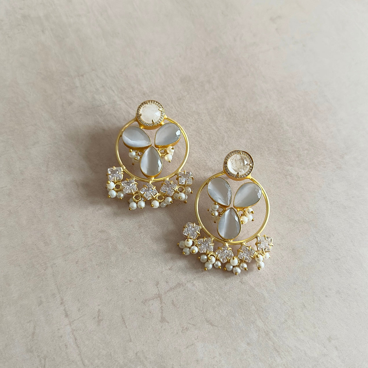 Elevate your look with Belle Grey Crystal Earrings. The statement design features hand cut dove grey stones and sparkling cubic zirconia crystals, adding a touch of sparkle and shine to any outfit. Make a statement with these exquisite earrings.<br>Earring drop 5x4cm