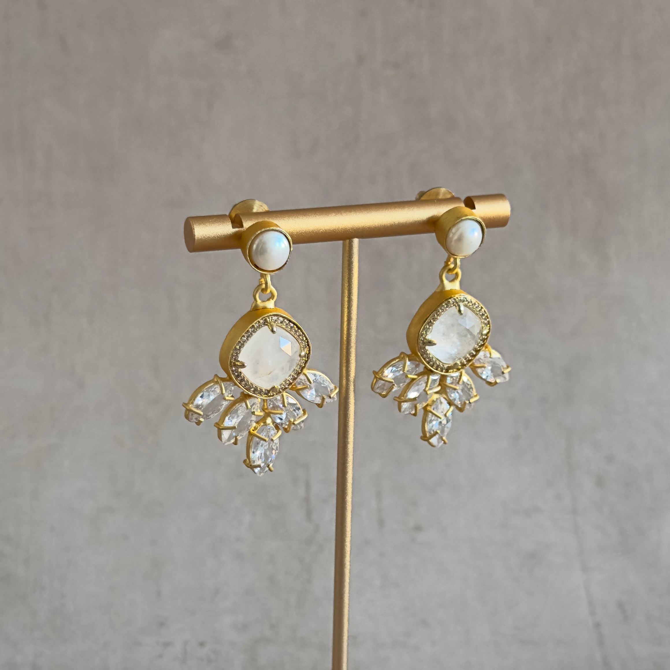 Add a touch of elegance to your outfit with our Crystal Drop Earrings! These beautiful earrings feature a shimmering white quartz crystal and cubic zirconia for extra sparkle. Elevate your style with these stunning earrings that will catch the eye of everyone around you.