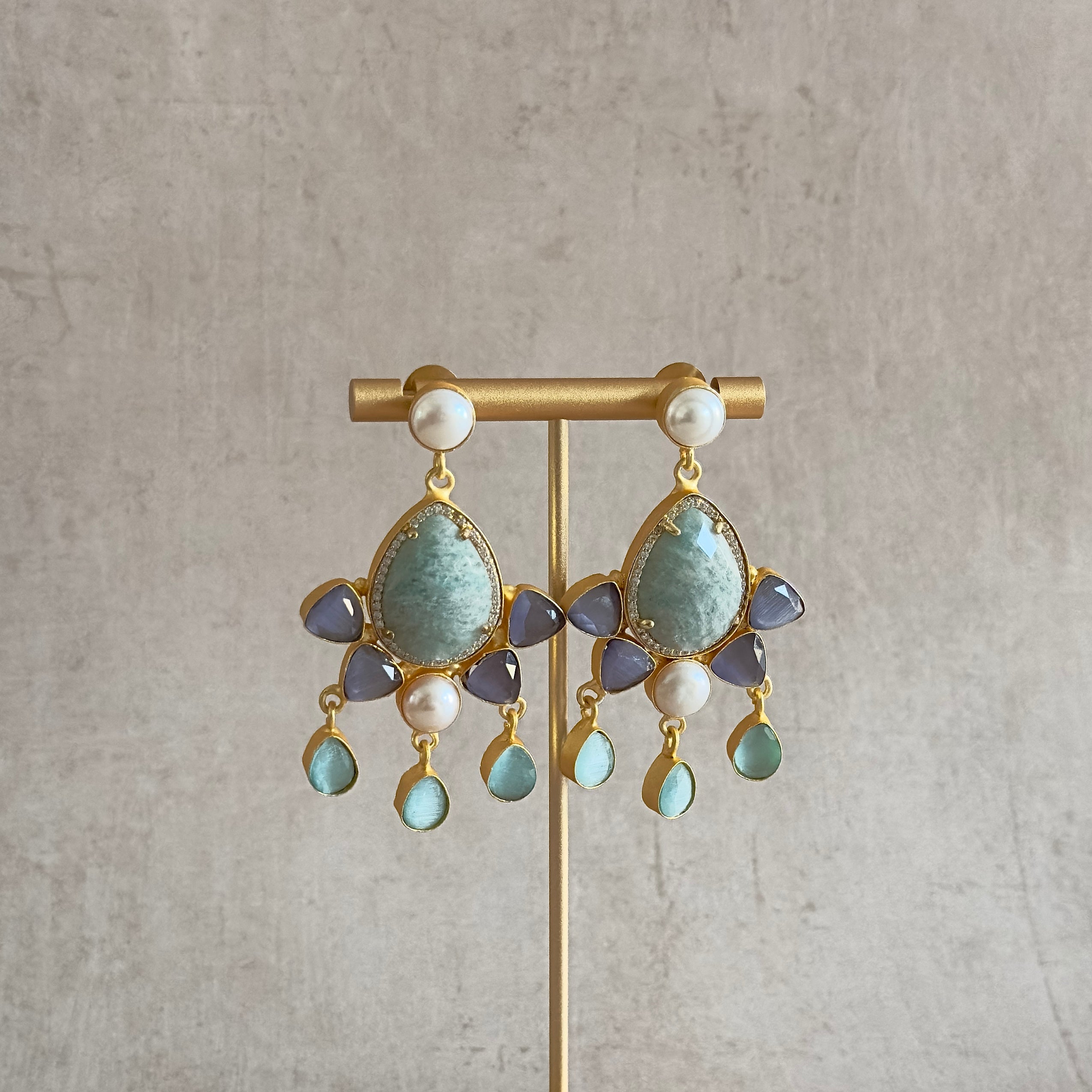 Elevate your style with our Nara Jade Drop Earrings. Made with multi gemstones, these earrings add a bold and sophisticated touch to your look. The perfect statement accessory for any occasion, these earrings exude luxury and exclusivity. Upgrade your jewelry collection with this stunning pair.