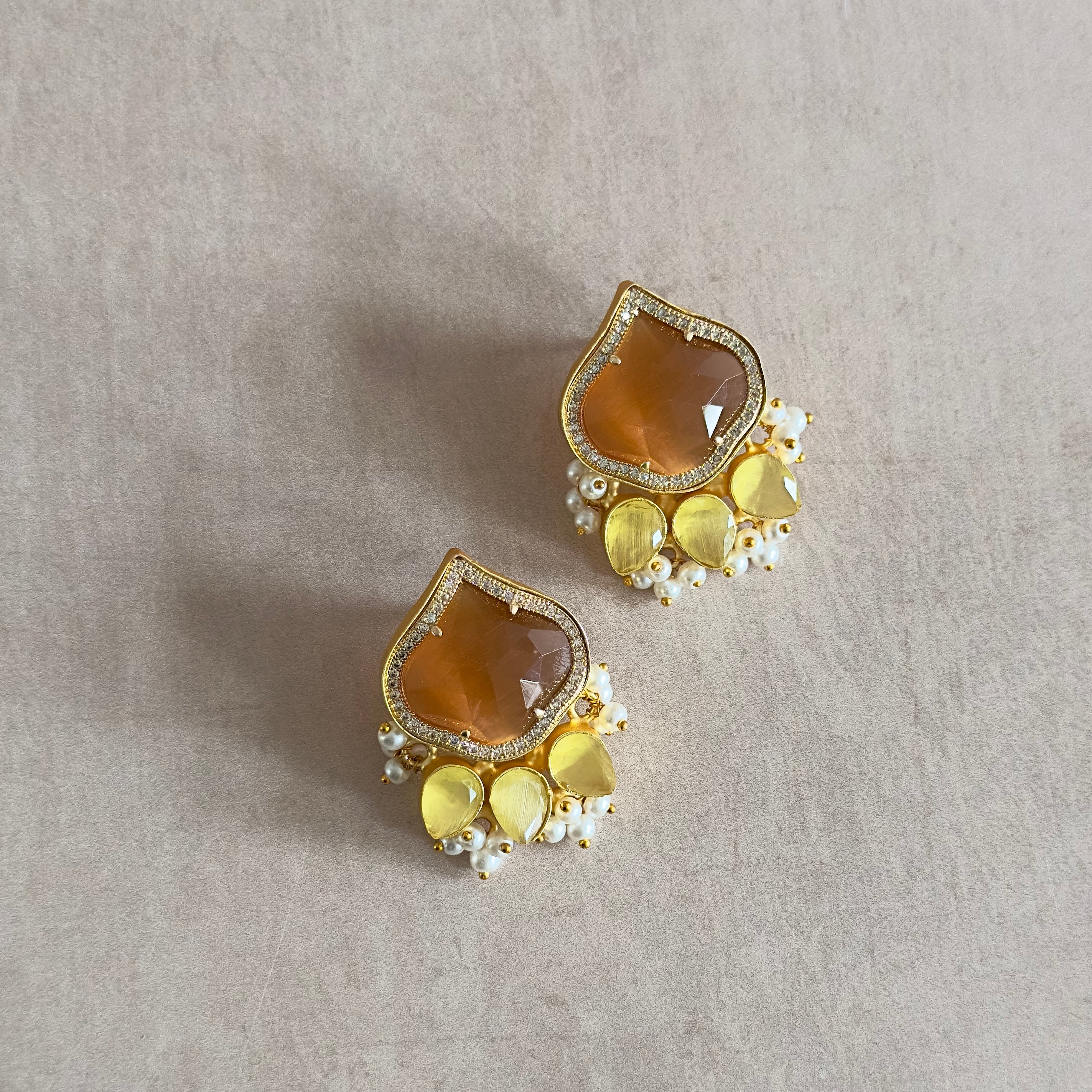 Elevate your summer wardrobe with the Aria Honey Stud Earrings, featuring hues of honey and lemon that evoke the warm, sunny days of the season. These earrings will add a touch of natural beauty to any outfit, making you feel effortlessly stylish and radiant.