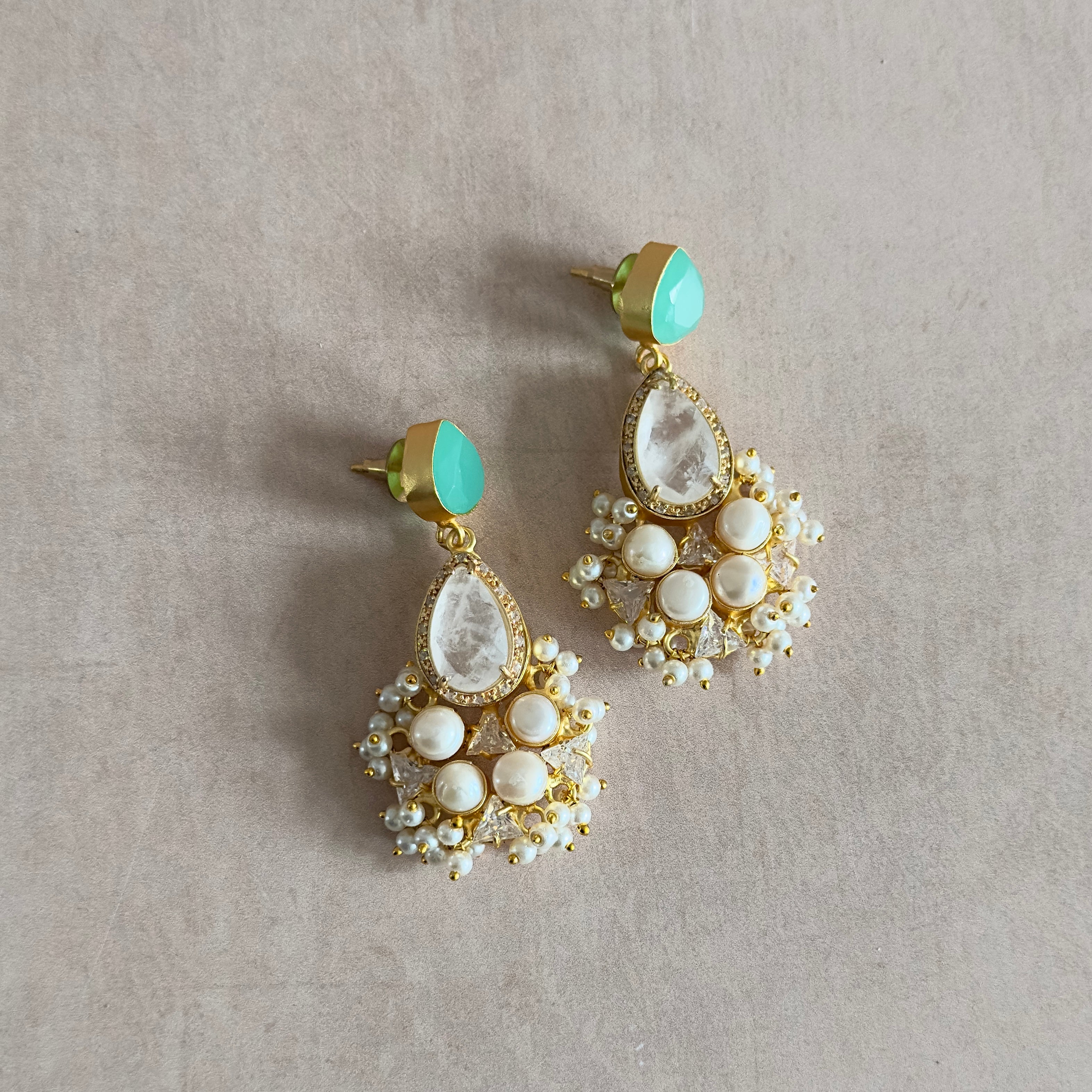 Elevate your style with the Romee Mint Drop Pearl Earrings. Made with stunning white quartz and lustrous freshwater pearls, these earrings add a touch of elegance to any outfit. Perfect for any occasion, these earrings are a must-have for any jewelry collection.