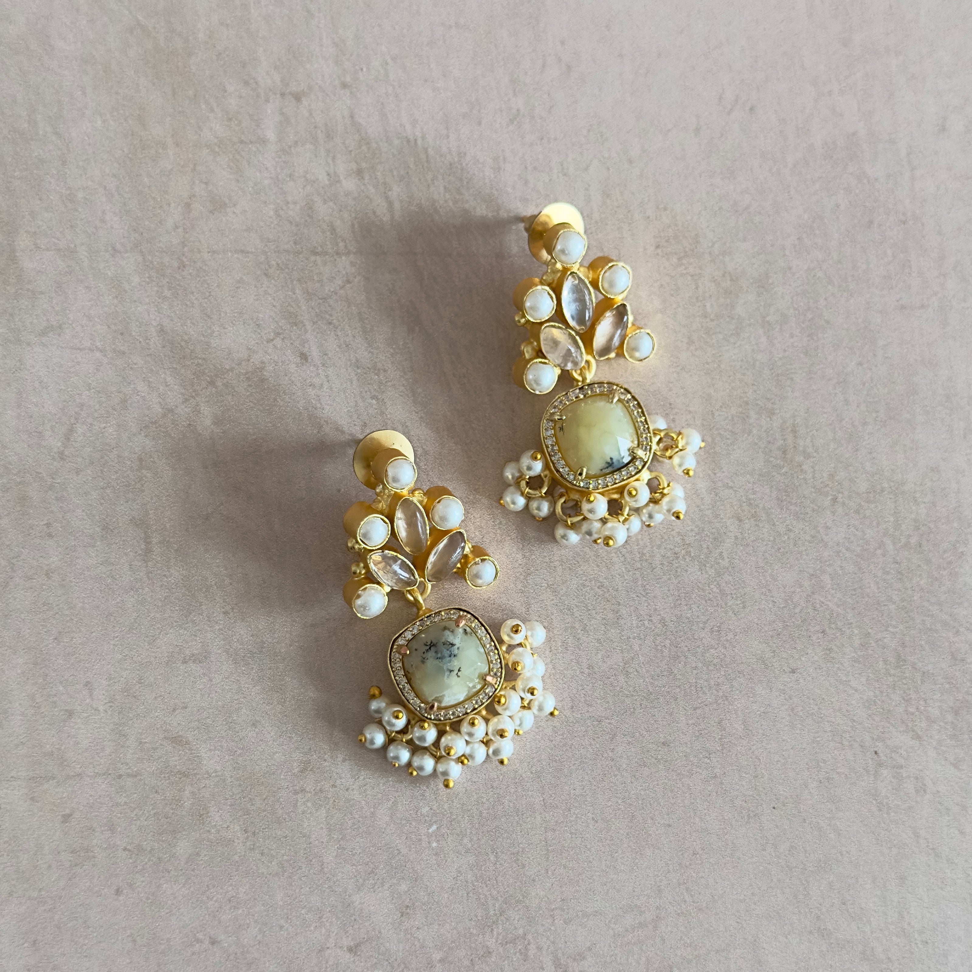 Add a touch of elegance to any outfit with our Priti Drop Earrings. Designed with a cute drop design and multi gemstones in hues of pearl and pastels, these earrings exude charm and sophistication. Elevate your style and feel confident with these beautiful and versatile earrings!