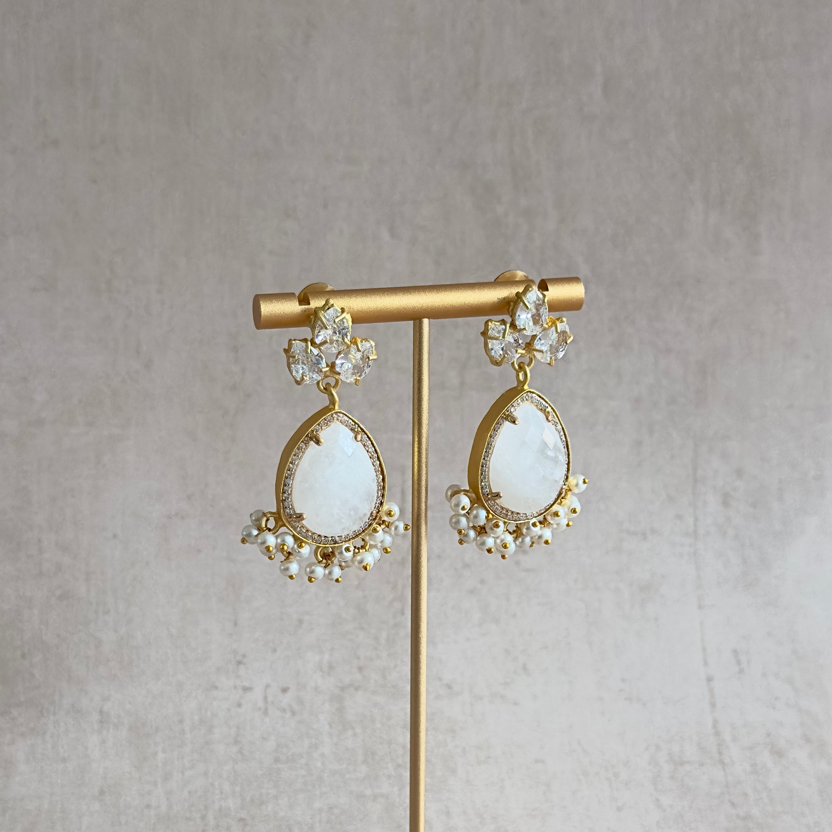 Enhance your elegance with Emilia White Crystal Drop Earrings. Featuring stunning white quartz crystals, these earrings will add a touch of sparkle to any outfit. Upgrade your style with the natural beauty of these handcrafted earrings. Elevate your look, and make a statement.