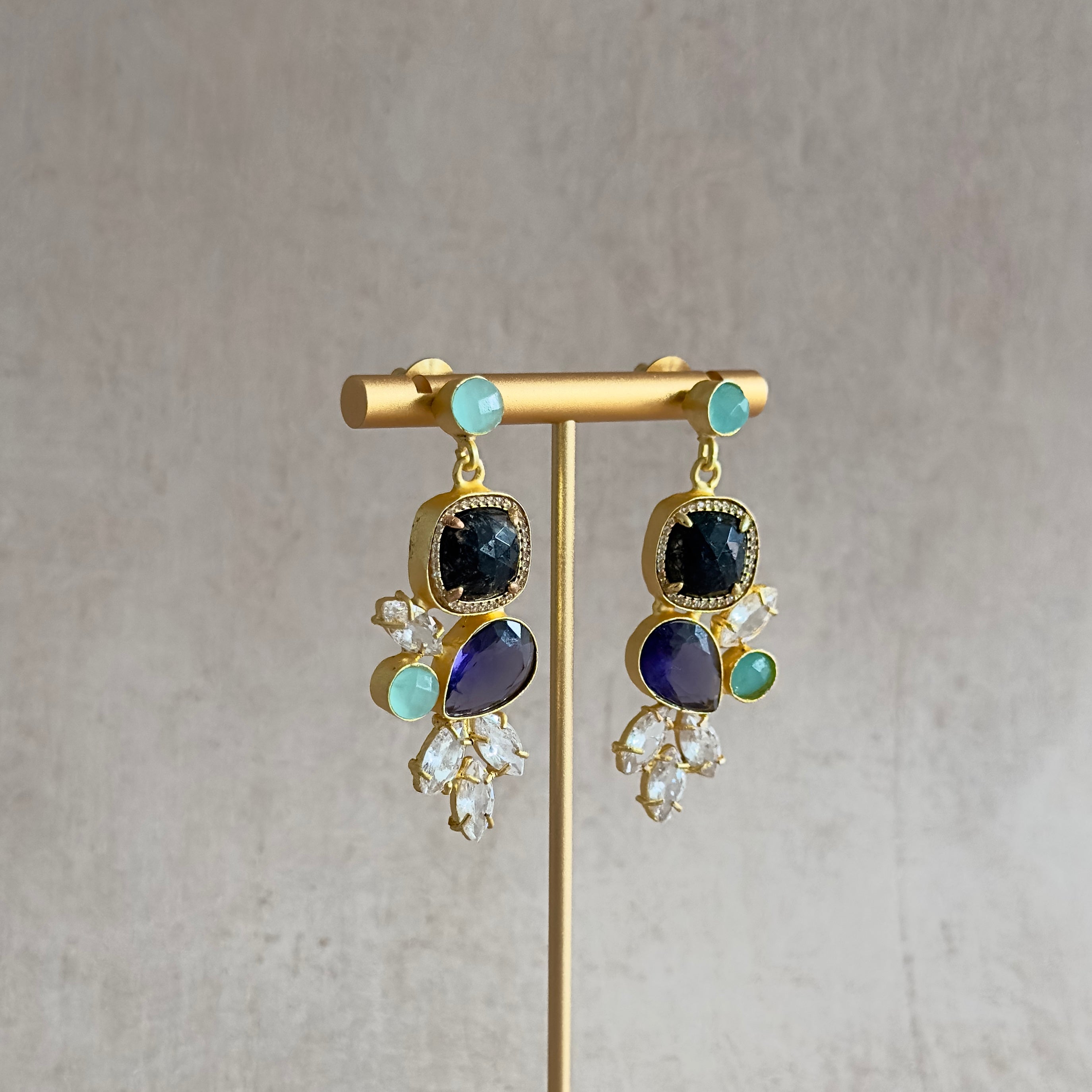 Elevate your look with Malika Mint Drop Earrings! Featuring stunning hues of mink and purple, these earrings are designed to add a touch of elegance to any outfit. The sparkling CZ crystals add a touch of glamour. Perfect for any occasion.