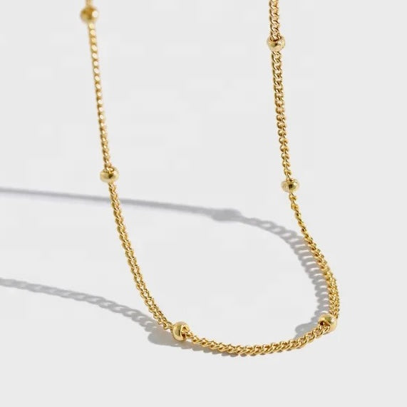 Our Darcy fine Bead chain Necklace is crafted from 925 sterling silver and adorned with 18k gold plating. Its timeless design exudes sophistication and exclusivity, making it the perfect accessory to accessorise any day or evening wear.  Chain Drop 42cm open length. Chain thickness 1mm