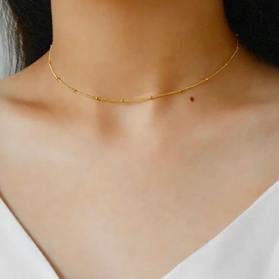 Our Darcy fine Bead chain Necklace is crafted from 925 sterling silver and adorned with 18k gold plating. Its timeless design exudes sophistication and exclusivity, making it the perfect accessory to accessorise any day or evening wear.  Chain Drop 42cm open length. Chain thickness 1mm