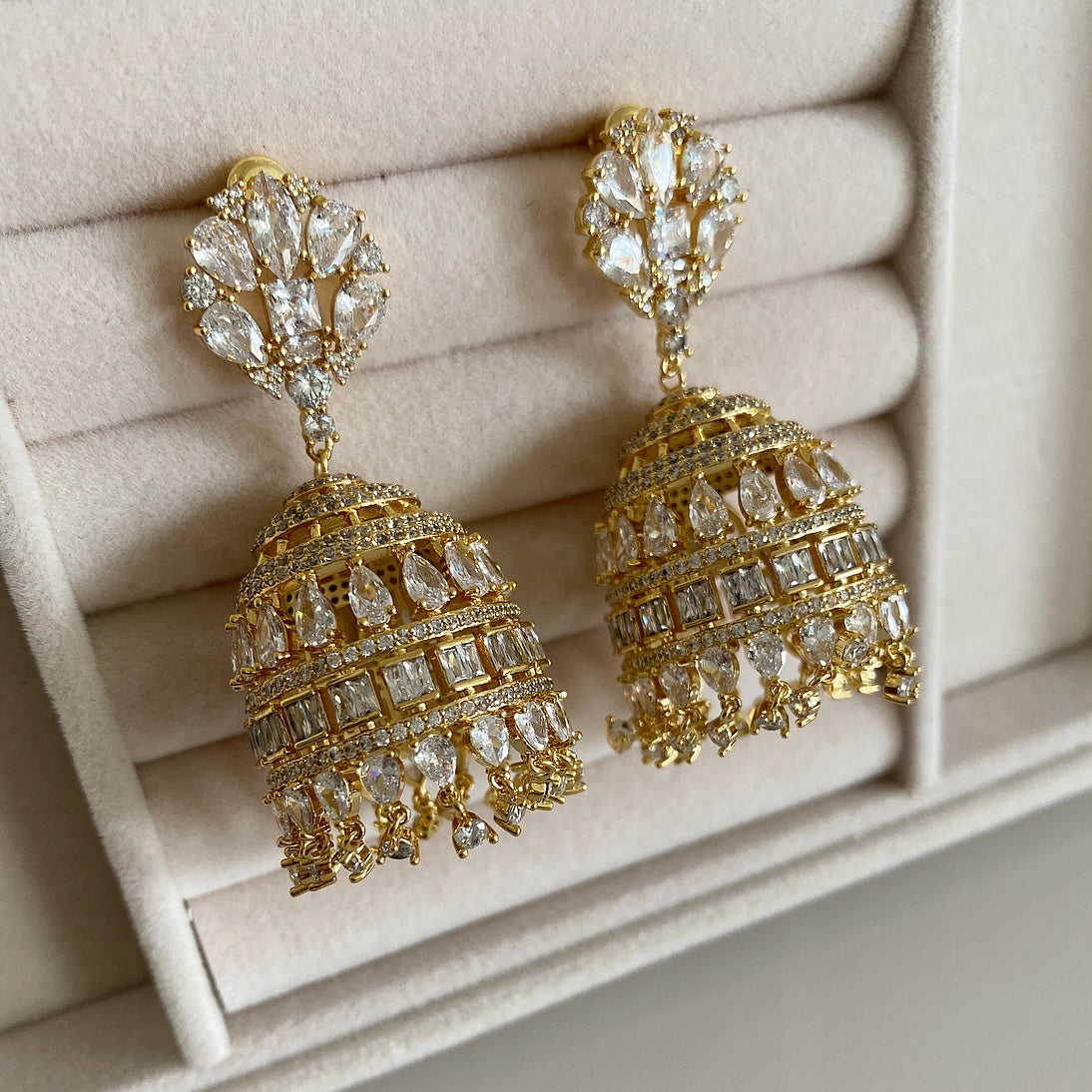 Haifa Crystal Jhumka is a unique combination of traditional and modern design. This jhumka is crafted with cz crystals, making it a luxurious, eye-catching statement piece. With a timeless design and quality construction, this beautiful piece is sure to bring a touch of elegance to any look. Earring drop 6x3cm