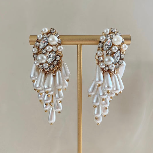 Renè Earrings deliver timeless sophistication and stylish elegance. Crafted with teardrop pearls, this bestseller is a statement piece of jewellery sure to turn heads, create your signature look with Ahseya & Co.  Details: Earring drop 6.5cm