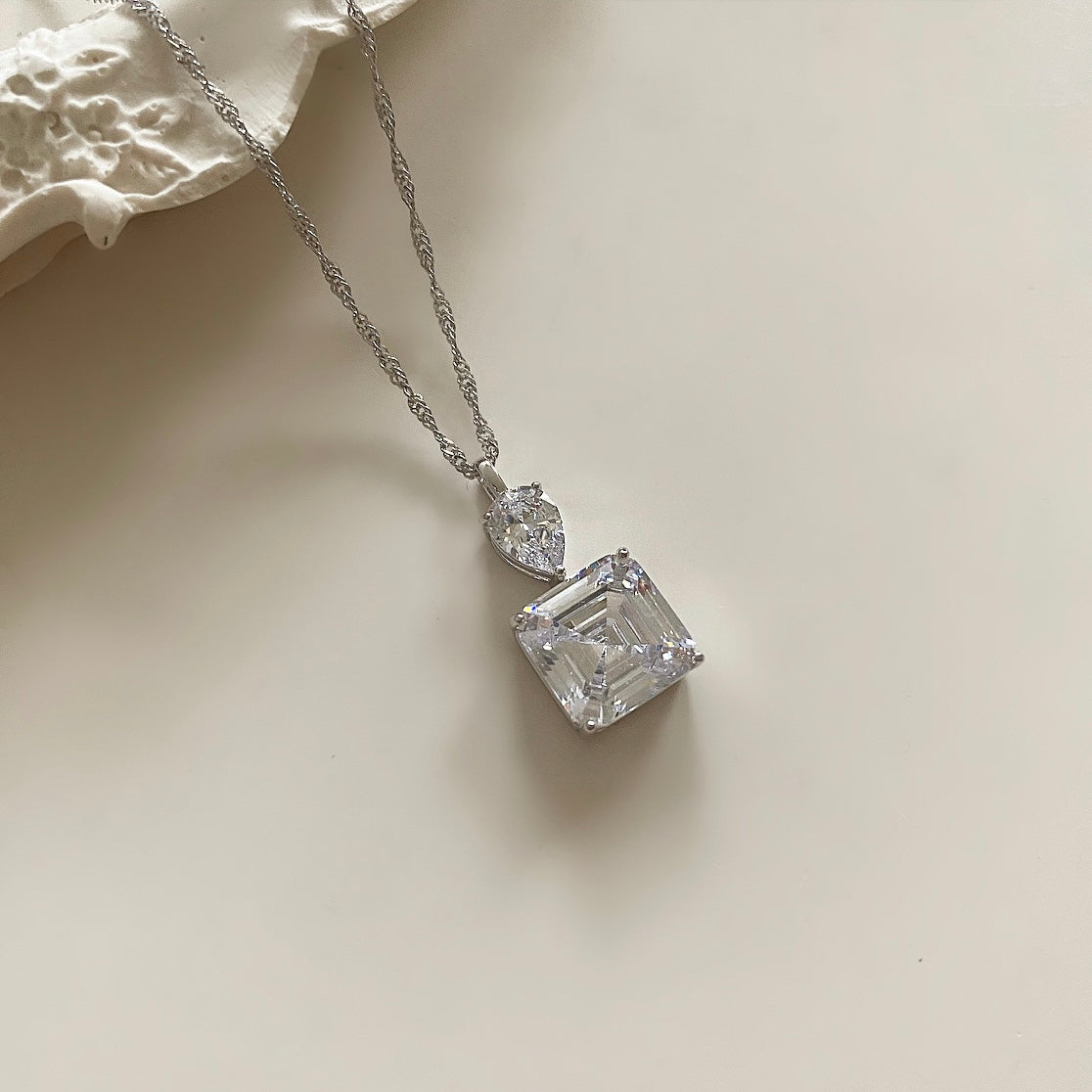 This beautiful Sterling Silver necklace features stunning crystal zirconia that will sparkle and shine all day. Expertly cut and polished to a high luster, the zirconia makes a bold statement without sacrificing comfort and elegance. Perfect for any occasion. Pair with crystal earrings for a complete look.  Necklace drop 23cm