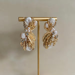 The Kate Earrings feature luxurious and classic elements, including gold, pearl, and crystal, creating a timeless piece of jewelry. The combination of the gold, delicate pearls, and sparkling crystals ensure maximum elegance. Earring drop 5cm