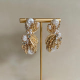 The Kate Earrings feature luxurious and classic elements, including gold, pearl, and crystal, creating a timeless piece of jewelry. The combination of the gold, delicate pearls, and sparkling crystals ensure maximum elegance. Earring drop 5cm