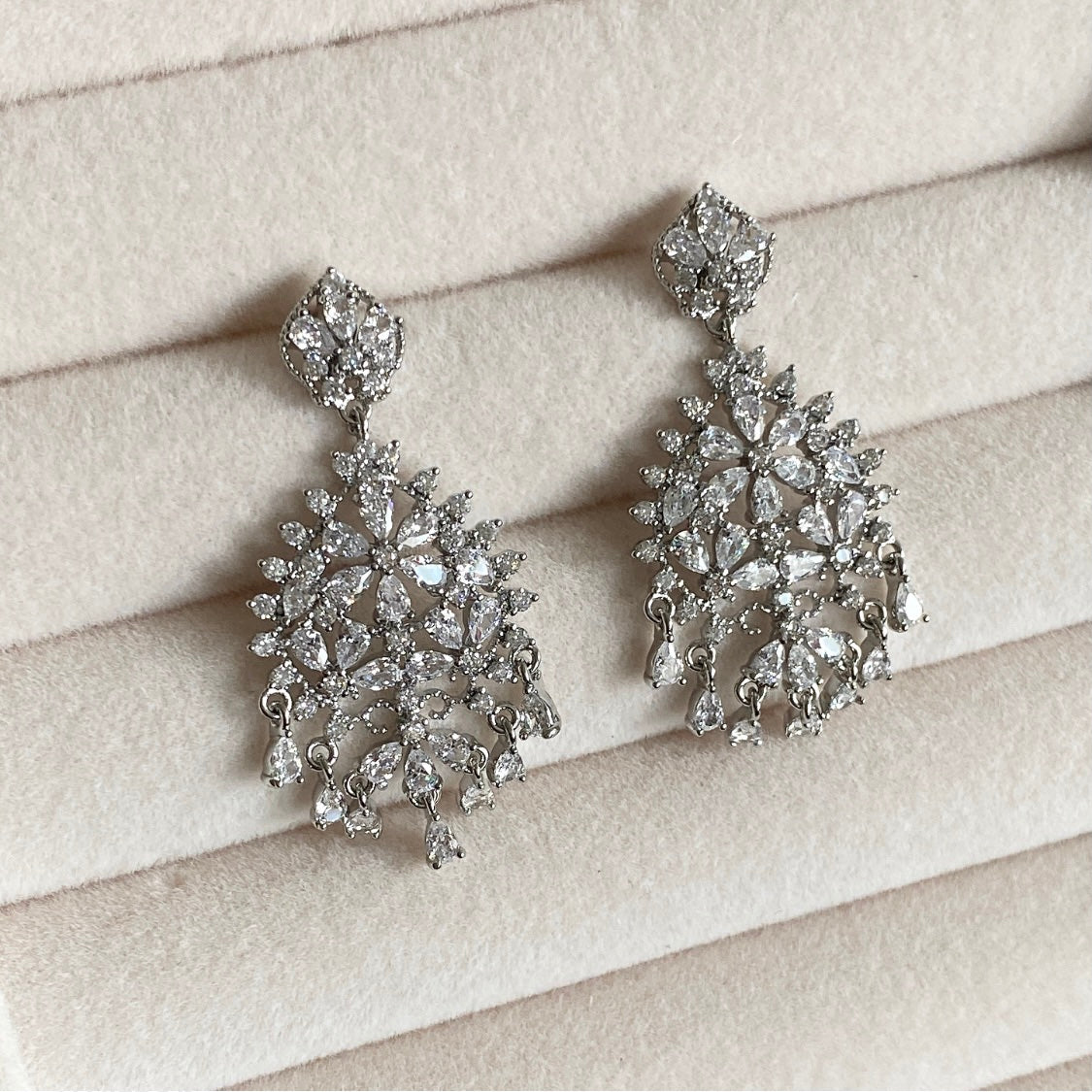 Bejewel your look with our Dawn Crystal Drop Earrings, featuring lustrous cz crystals set in an elegant and sparkly design. This luxurious piece of jewelry adds a touch of refinement that exudes beauty and sophistication.